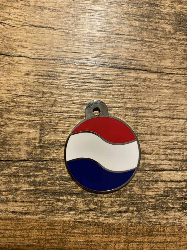 Ronde penning groot met nederlandse vlag aan 1 zijde
